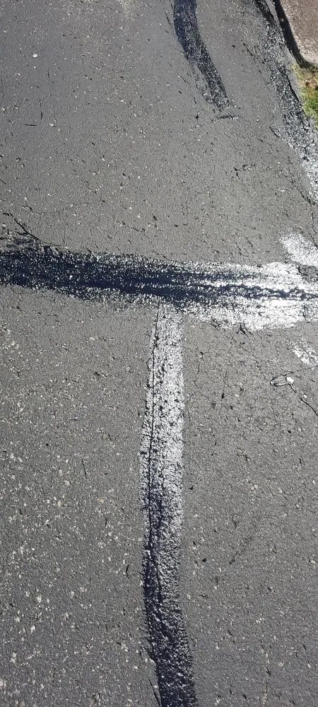 Slide of Asphalt Sealcoating & More