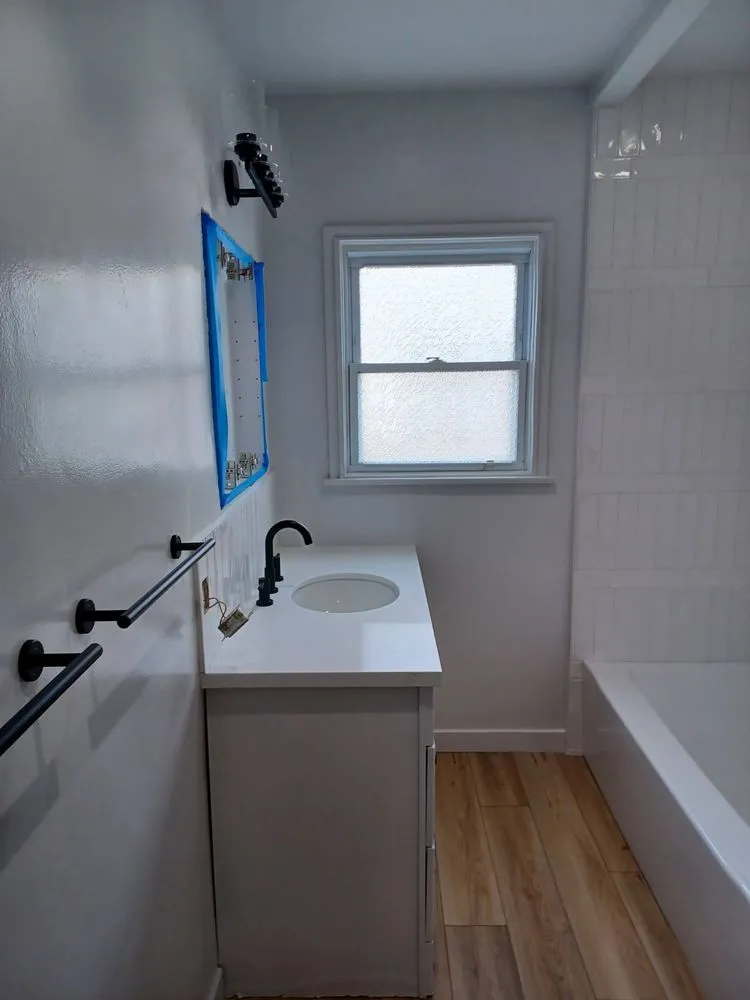 Slide of Camelot Plumbing & Handyman Service