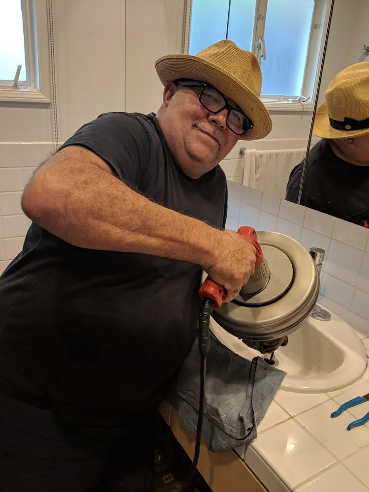 Slide of Happy Sam's Plumbing