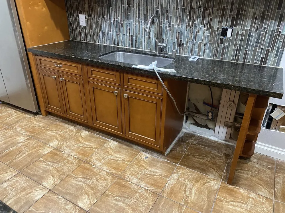 Slide of Henrys Leak Repair And Water Restoration Services