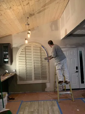 Henry's Painting And Drywall Logo