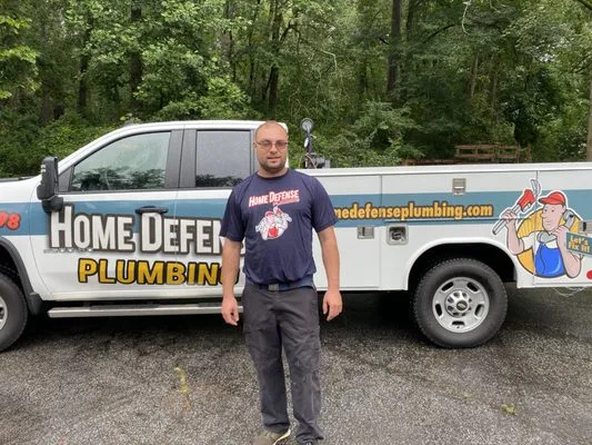 HOME DEFENSE PLUMBING Logo