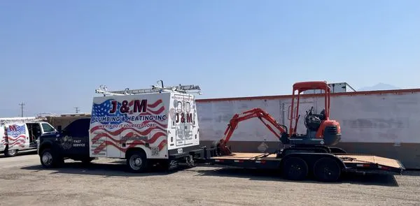 J & M Plumbing Heating & Air Conditioning Logo