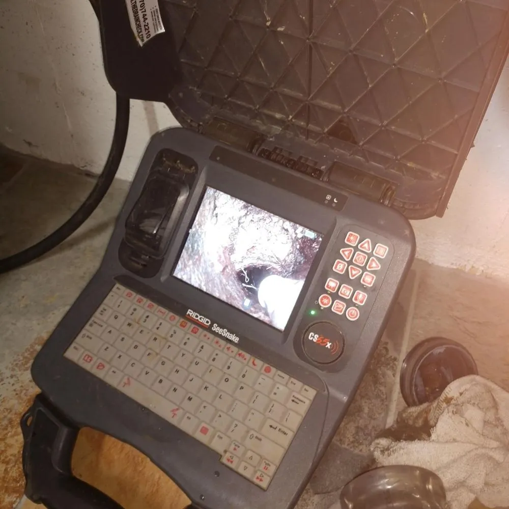 Slide of Jake The Snake Drain Cleaning