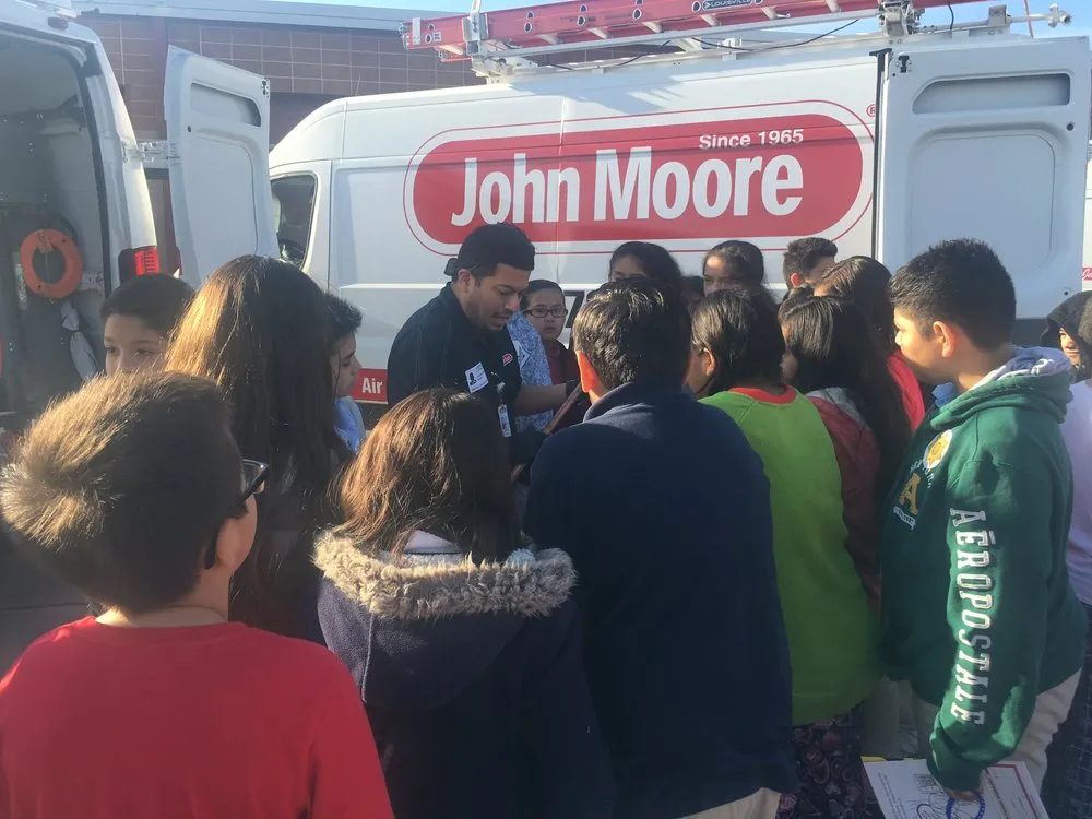 Slide of John Moore Services