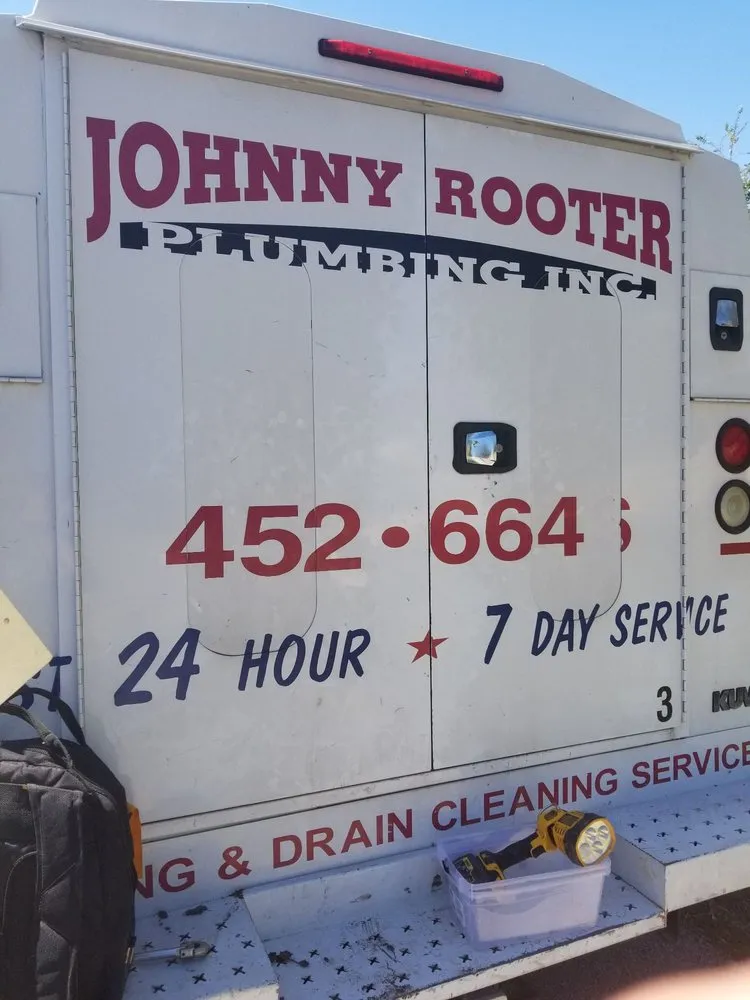 Slide of Johnny Rooter Plumbing