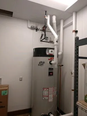 Komar Anchor Plumbing Logo