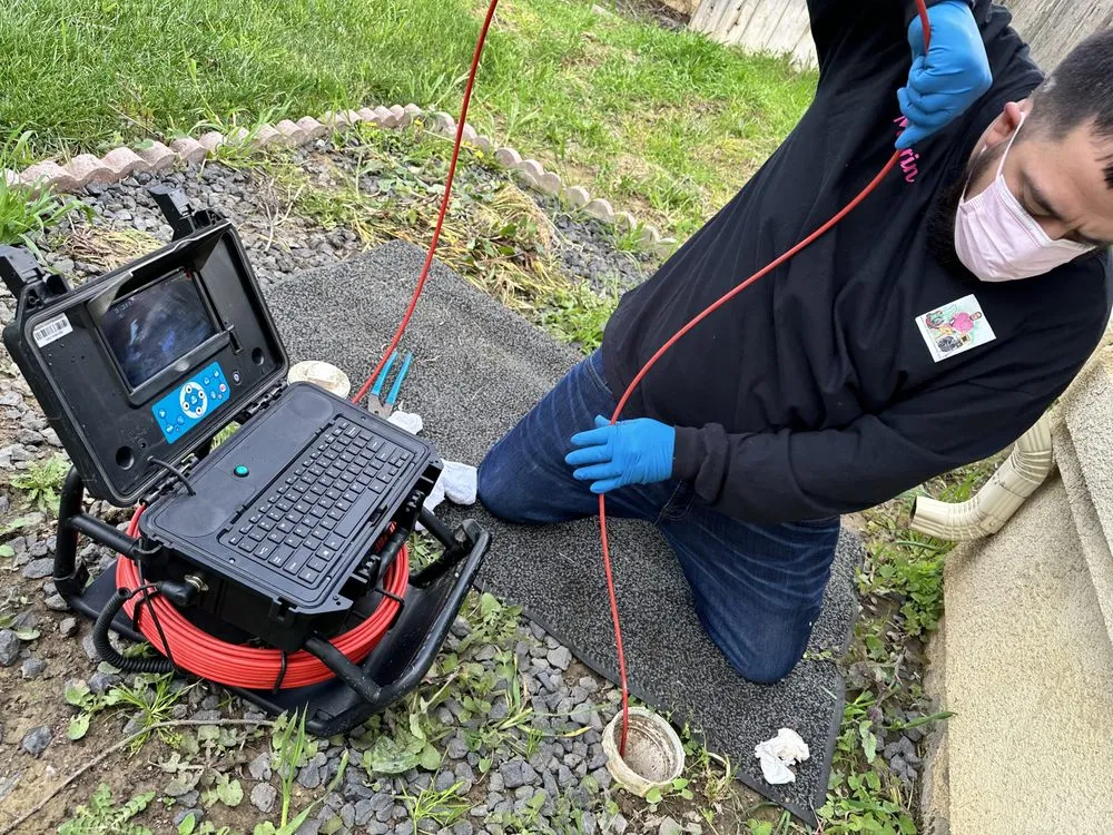 Slide of Martins Drain Cleaning