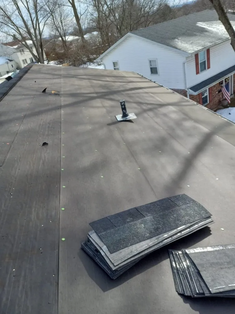 Slide of Menny Roofing