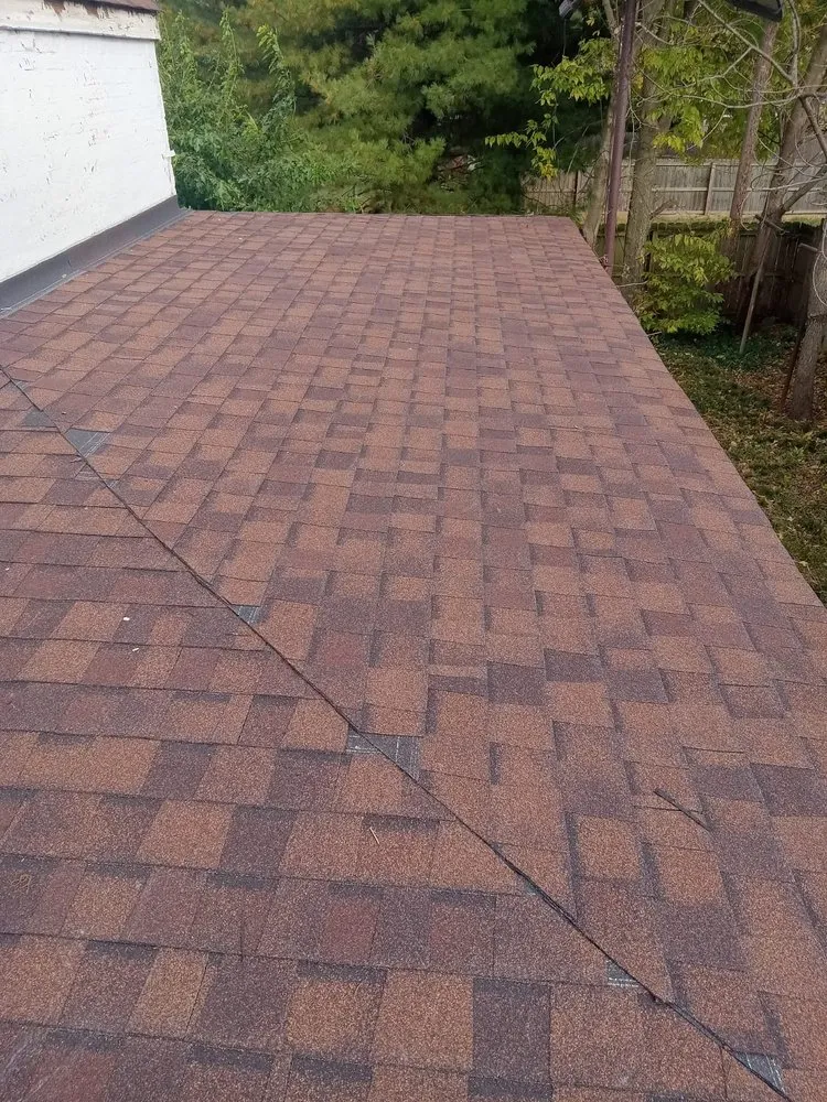 Slide of Menny Roofing