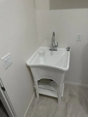 Nando’s Copper Plumbing Logo