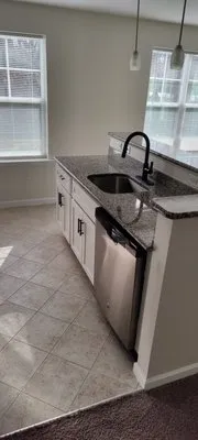 Neidig's Maintenance Service Logo