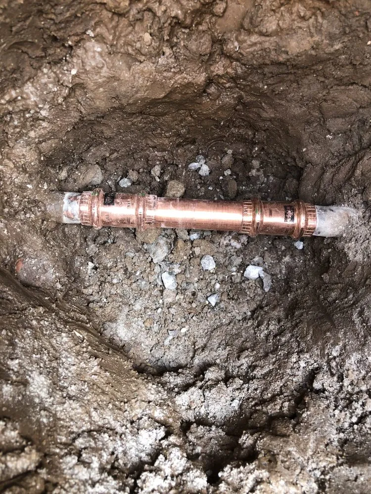 Slide of Pipe Down Slab Leak Repair