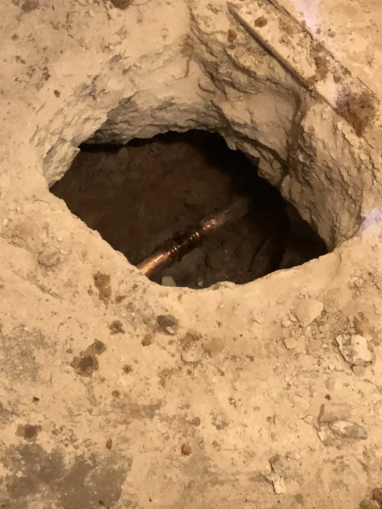 Slide of Pipe Down Slab Leak Repair