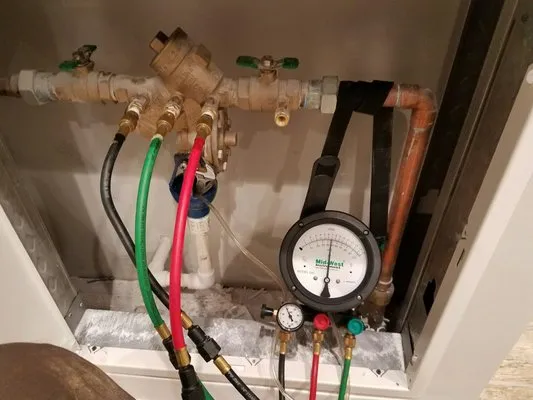 Root'n Toot'n Drain Cleaning Service Logo