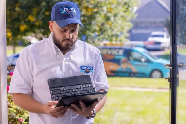 Service Plus Heating & Cooling Logo