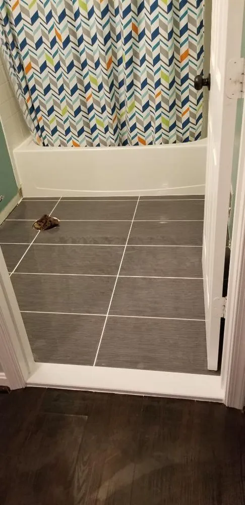 Slide of T&f Tile and Floors