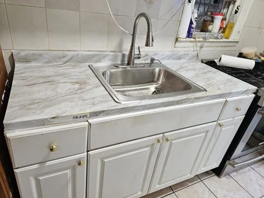 The Faucet Experts Logo