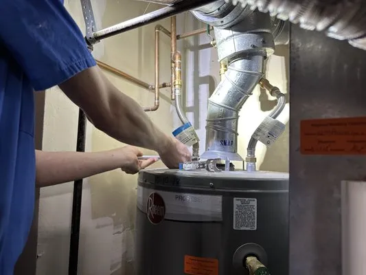 The Happy Plumber Logo