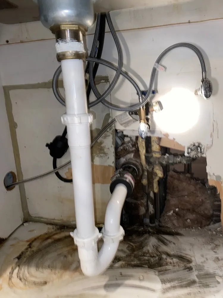 Slide of The in and out plumbing guy