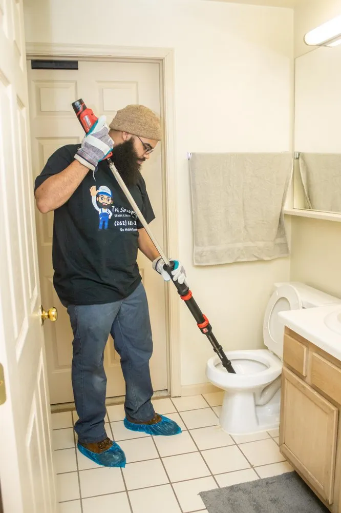 Slide of The Sewer Guys