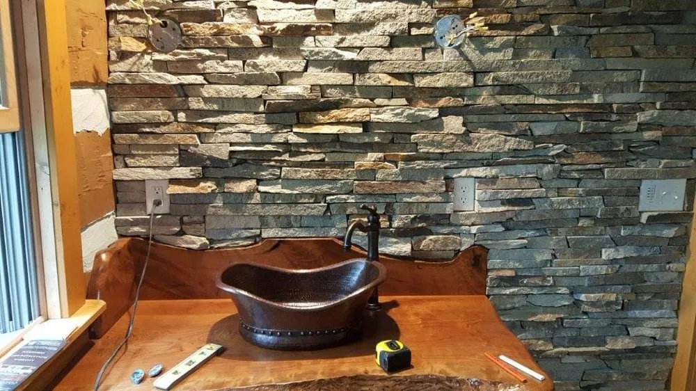 Slide of TL Henderson Plumbing