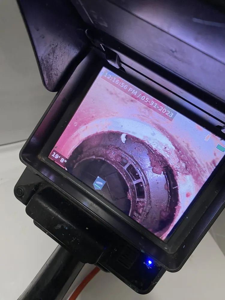 Slide of Top Dog Drain & Sewer Cleaning