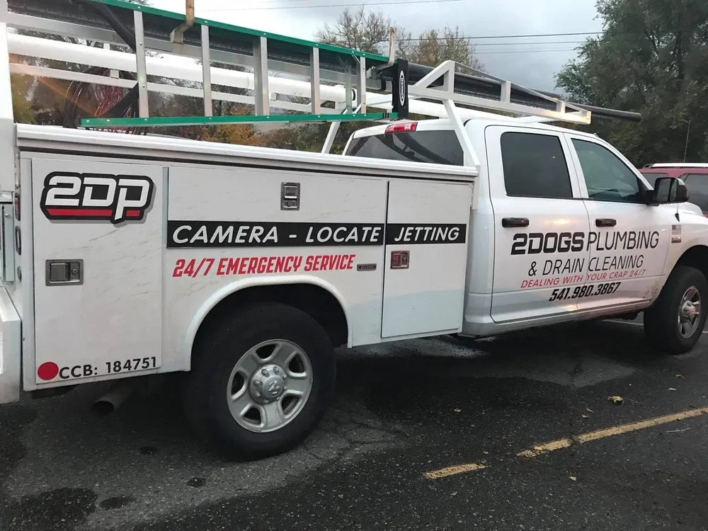 Slide of Two Dogs Plumbing and Drain Cleaning