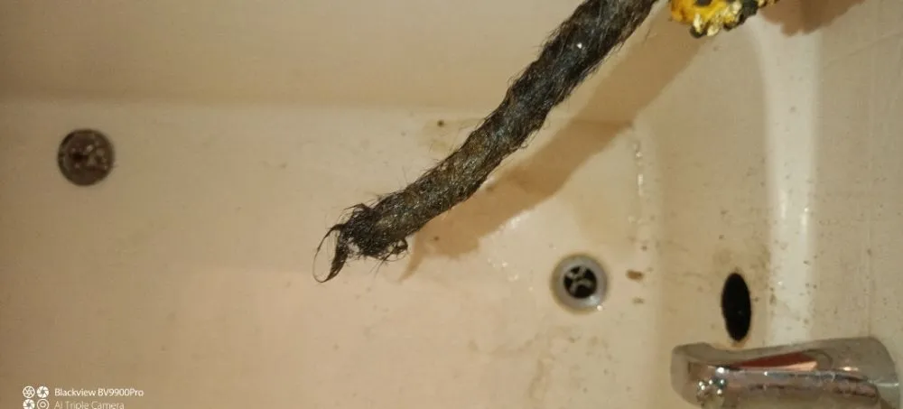 Slide of UNCLOG Drain Cleaning Service