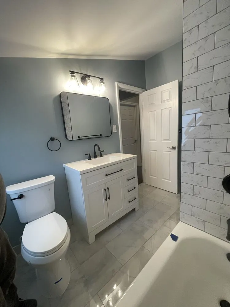 Professional water heater service for homes in Walled Lake, MI by Unico Remodeling